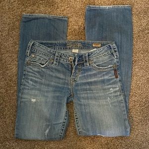 Silver jeans from buckle